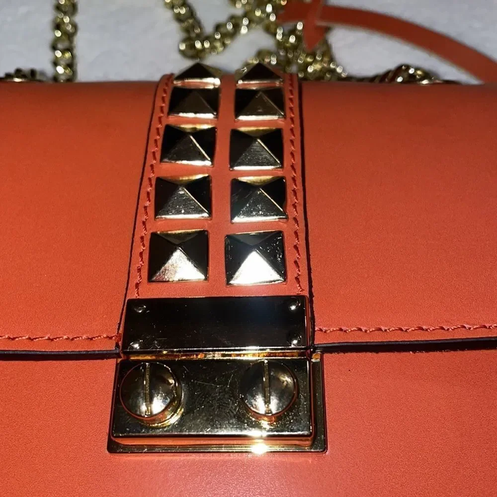 Persaman Gold/Orange crossbody bag studded
